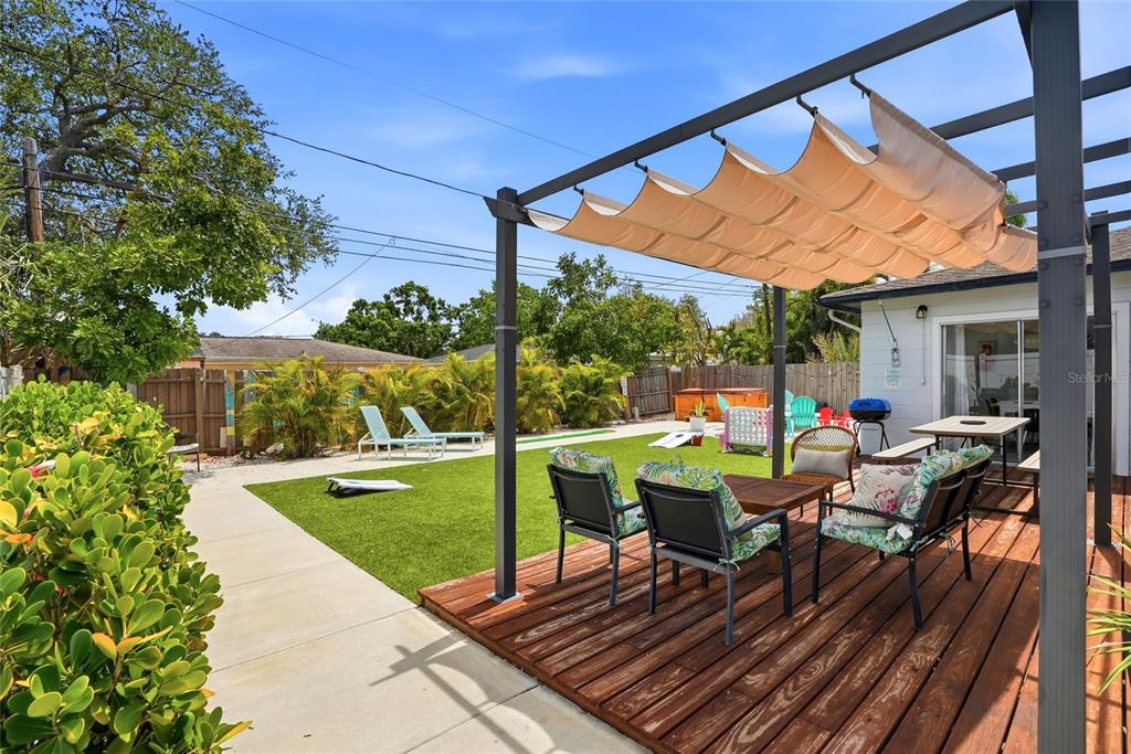 4939 100th Way North St. Petersburg, FL 33708 - Photo 4 of 43 a view of a patio with table and chairs and potted plants