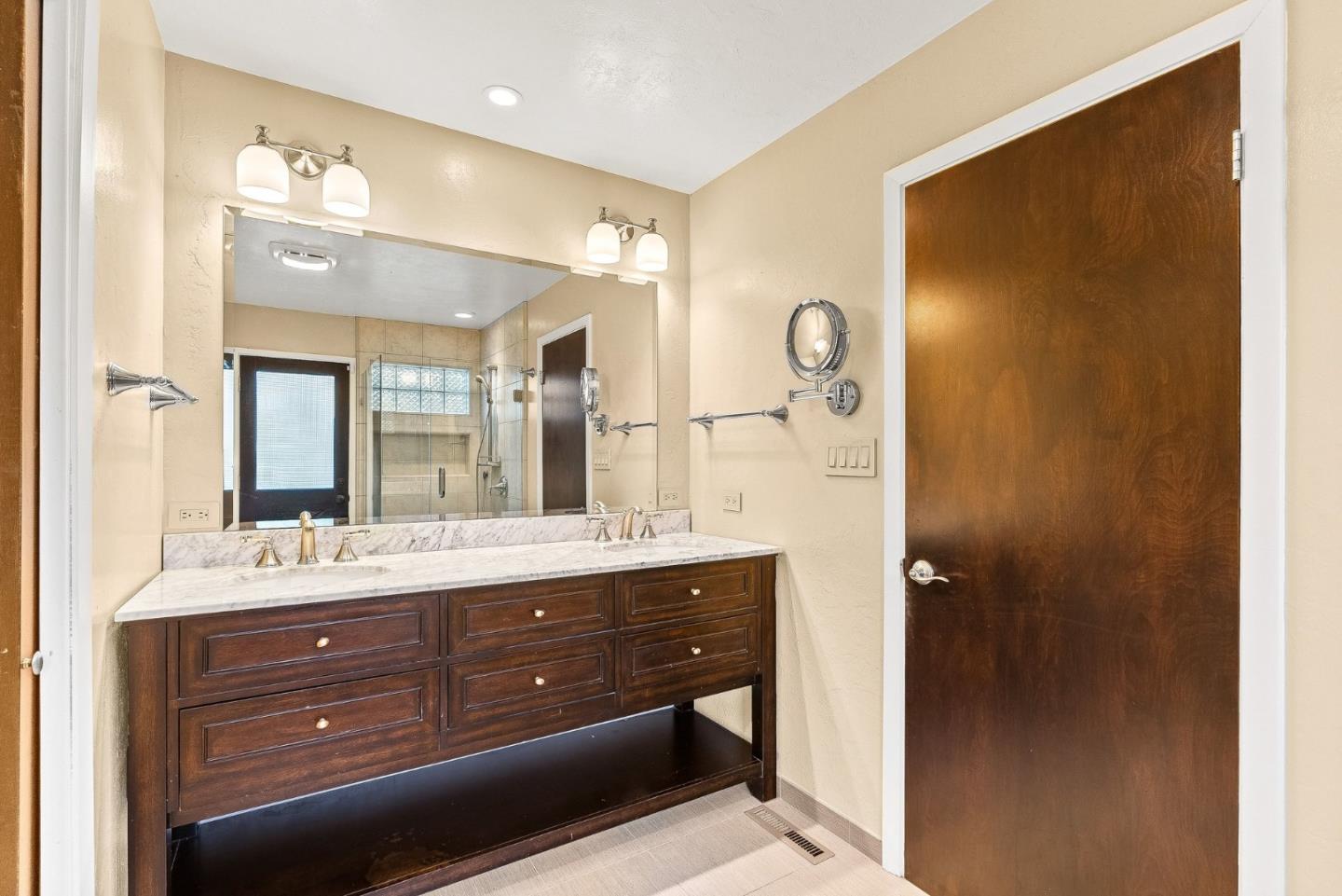 15460 Weather Rock Way Salinas, CA 93908 - Photo 12 of 32 a bathroom with a double vanity sink mirror and shower