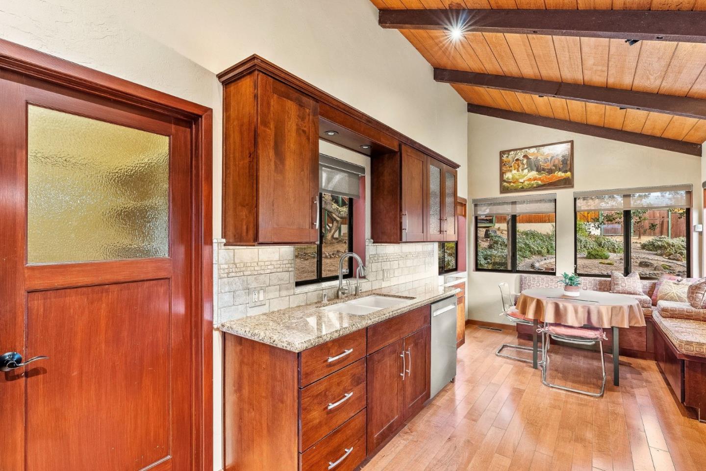 15460 Weather Rock Way Salinas, CA 93908 - Photo 8 of 32 a spacious bathroom with a granite countertop sink and a large mirror next to a window