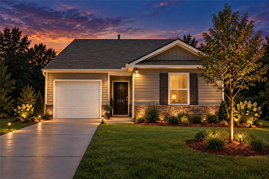 216 Boxbury Way Fountain Inn, SC 29644 - Photo 1 of 28 Stone accents and a manicured lawn enhance this single-story home's exterior character.