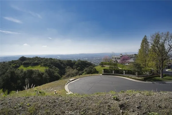 a view of a road with a yard