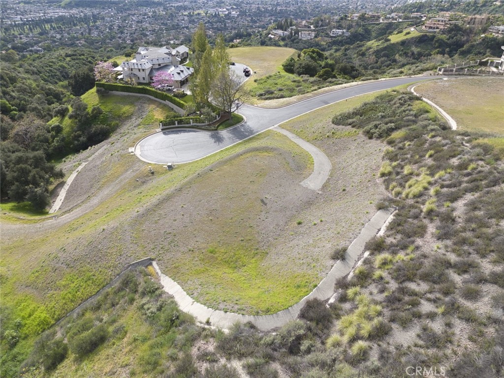685 Gordon Highlands Road Glendora, CA 91741 - Photo 21 of 35 a view of a swimming pool with a yard and seating space