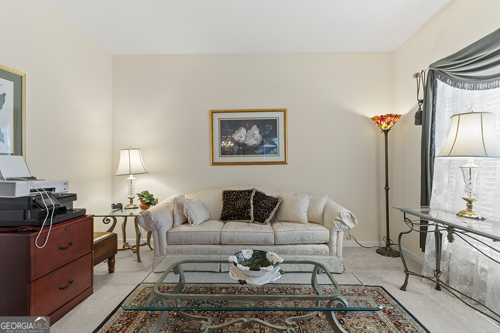 643 Millrun Court Macon, GA 31210 - Photo 22 of 45 a living room with furniture and wooden floor