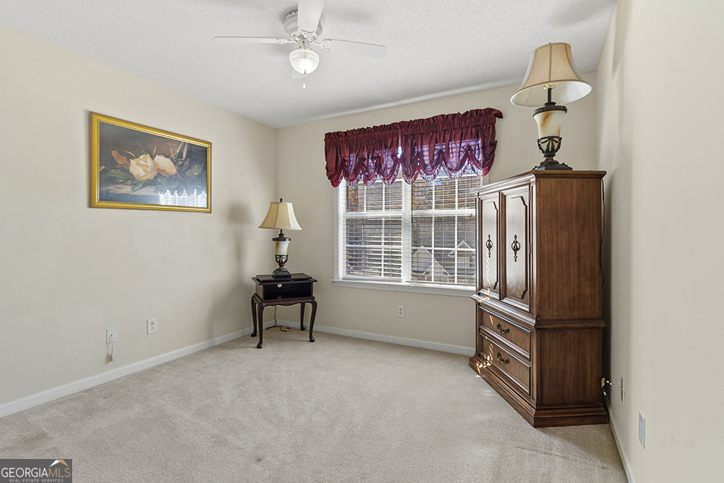643 Millrun Court Macon, GA 31210 - Photo 33 of 45 a living room with furniture and a window