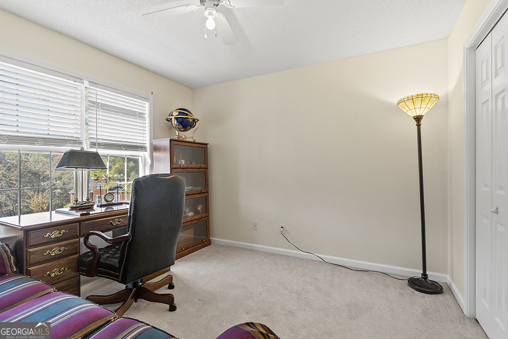 643 Millrun Court Macon, GA 31210 - Photo 35 of 45 a view of a workspace with furniture and a window