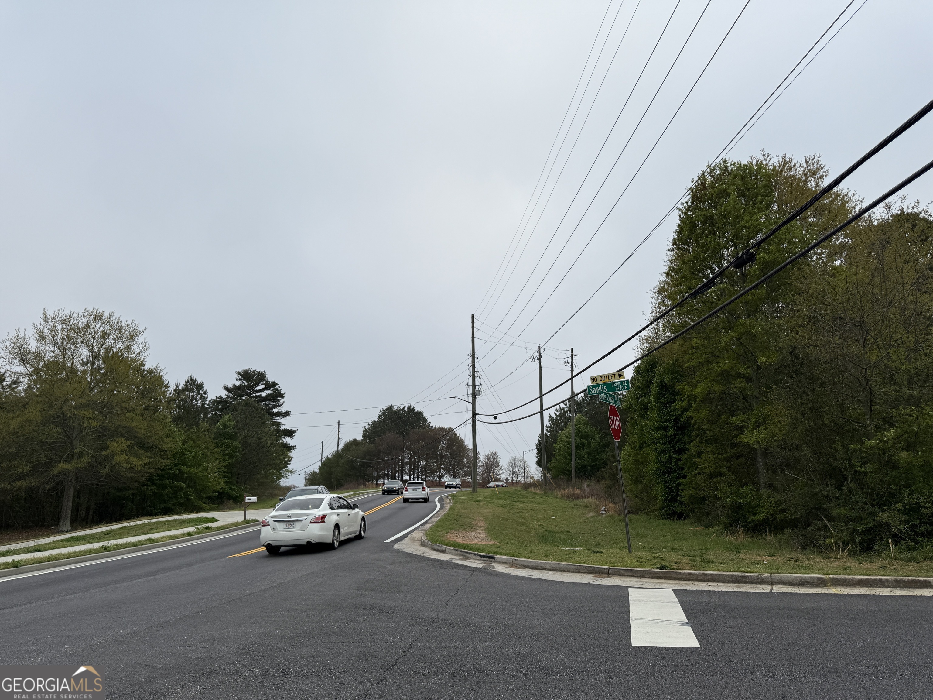 3550-3570 Sardis Church Road Buford, GA 30519 - Photo 3 of 6 a view of street with parked cars
