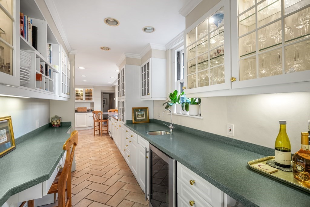 282 Beacon Street, Unit 6 Boston, MA 02116 - Photo 14 of 26 a living room with stainless steel appliances furniture a chandelier and a kitchen view