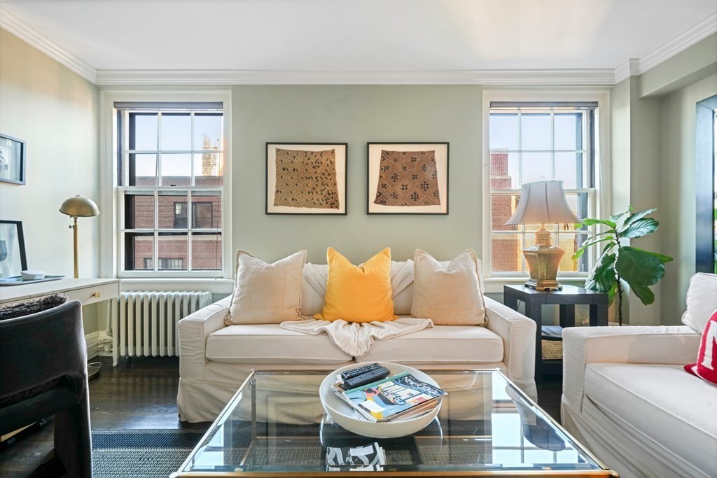 282 Beacon Street, Unit 6 Boston, MA 02116 - Photo 16 of 26 a living room with furniture and a table