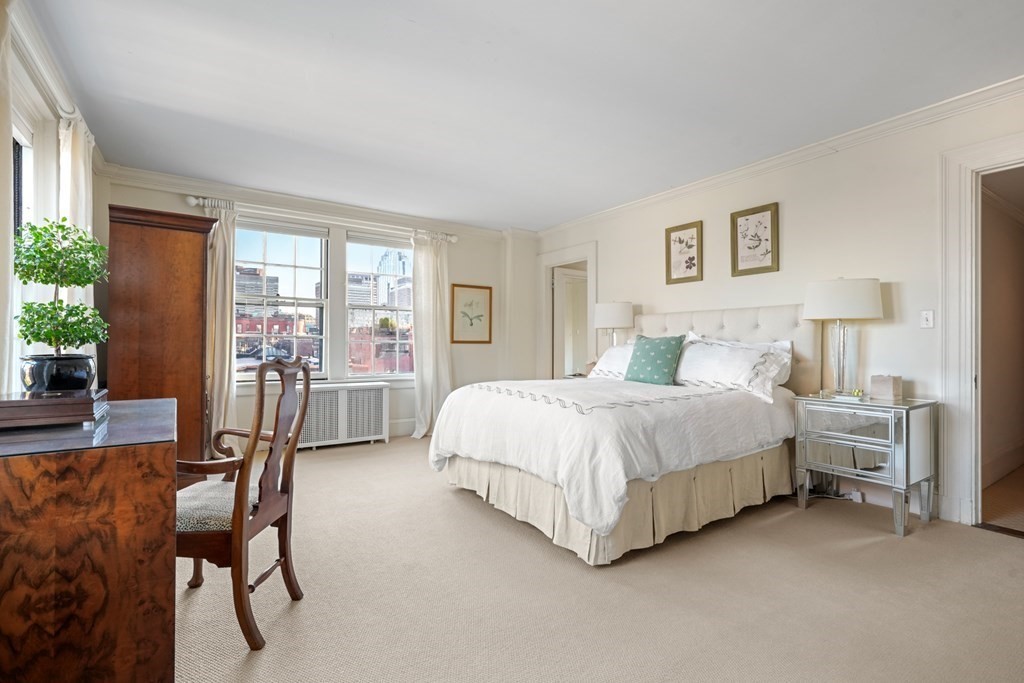 282 Beacon Street, Unit 6 Boston, MA 02116 - Photo 19 of 26 a spacious bedroom with a bed and a large window