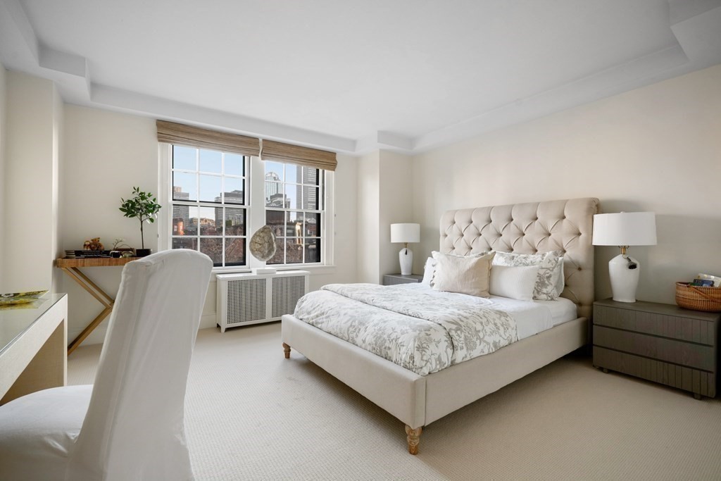 282 Beacon Street, Unit 6 Boston, MA 02116 - Photo 22 of 26 a bedroom with a bed and a large window