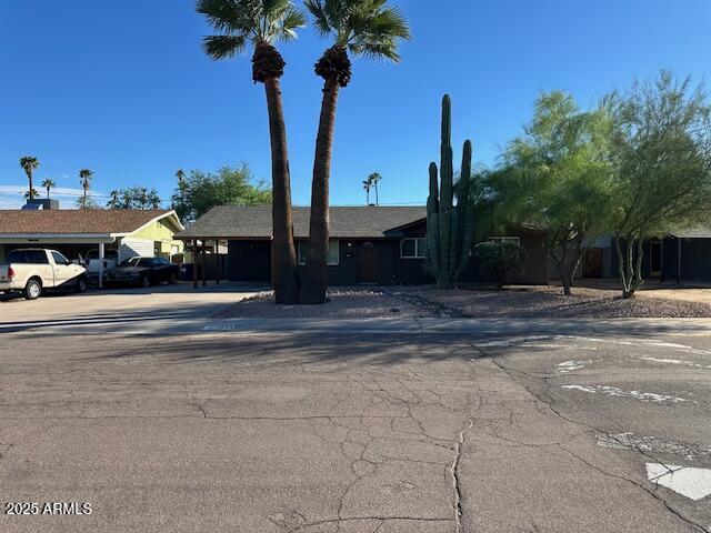 1025 West 12th Place Tempe, AZ 85281 - Photo 1 of 25 a view of street with small yard and a fountain