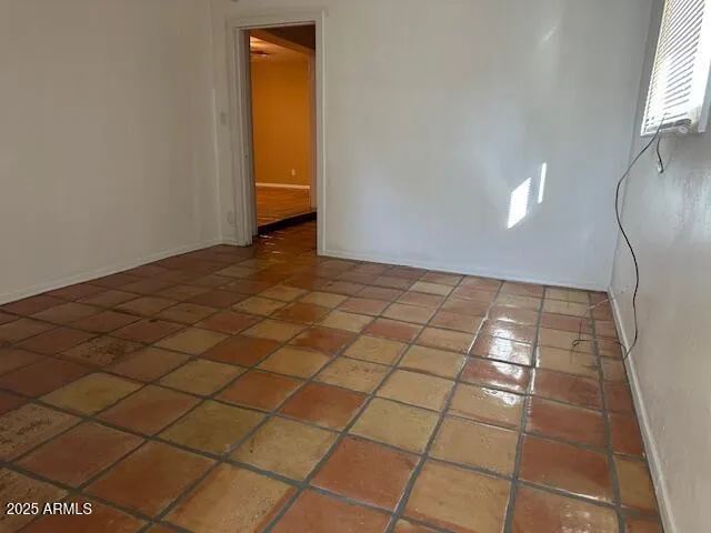 a view of an empty room and window