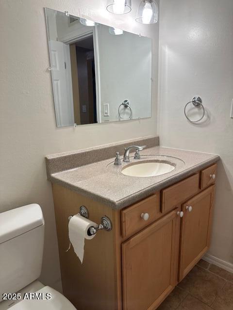 1025 West 12th Place Tempe, AZ 85281 - Photo 17 of 25 a bathroom with a sink and a toilet