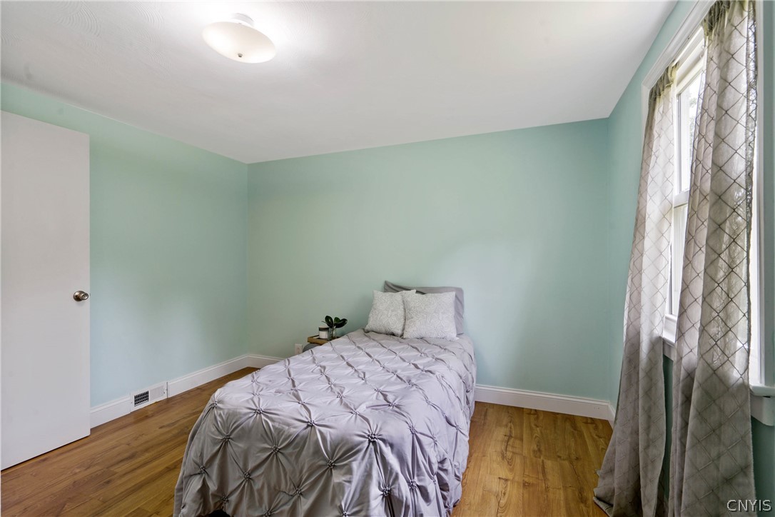 6130 South Bay Road Cicero, NY 13039 - Photo 20 of 30 The shape of this room allows for varying arrangements of furniture.