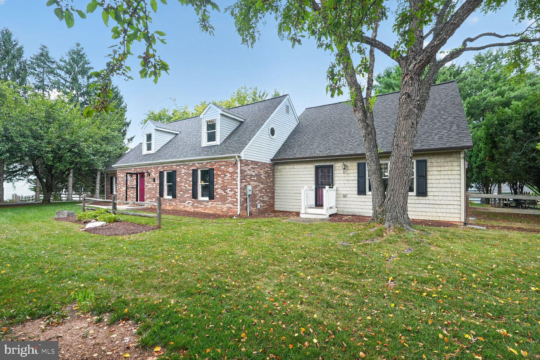 1030 Hook Road Westminster, MD 21157 - Photo 2 of 59 Charming home with lush greenery.