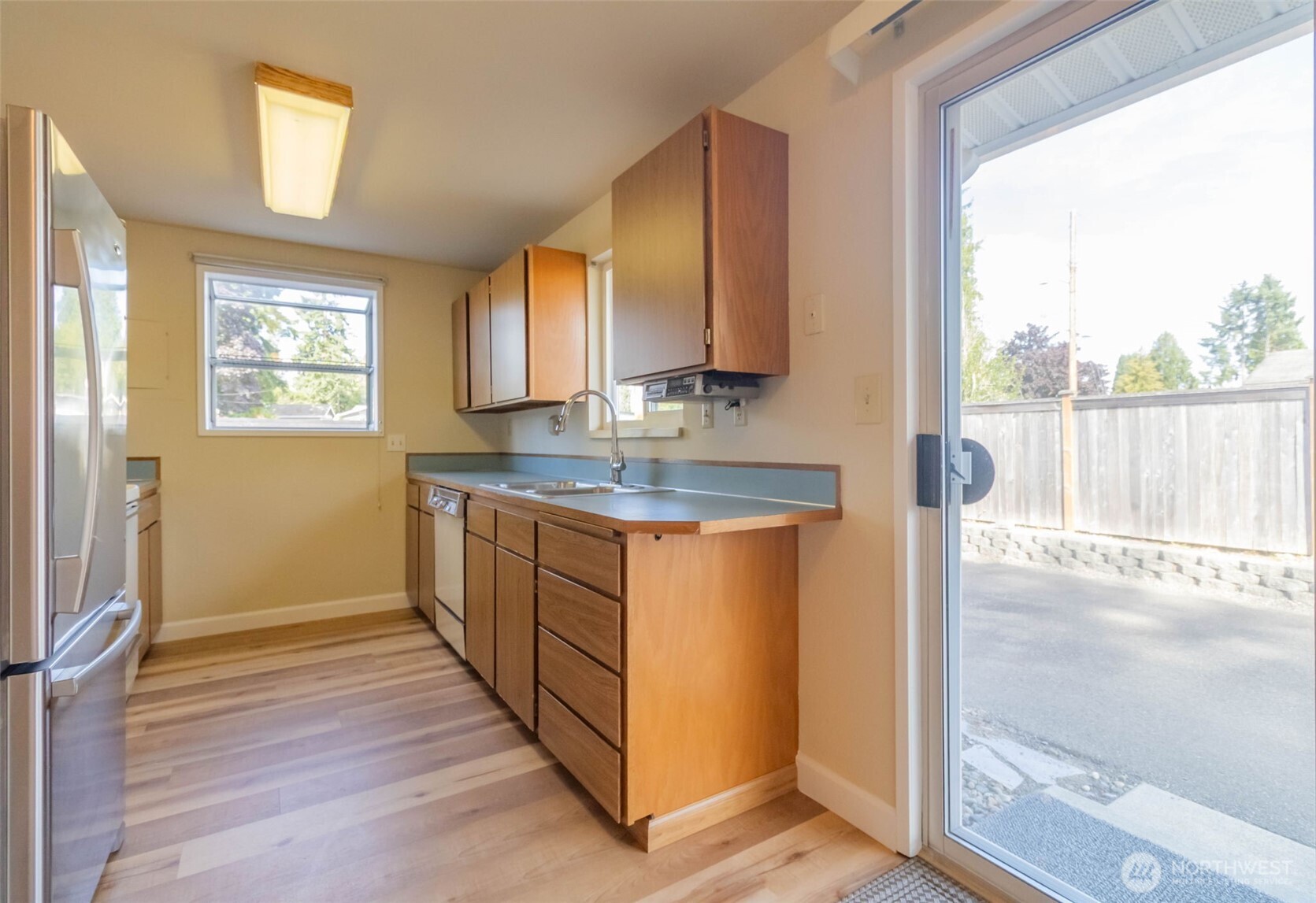 16958 121st Avenue Southeast Renton, WA 98058 - Photo 12 of 34 a kitchen with stainless steel appliances granite countertop a stove a sink and a refrigerator