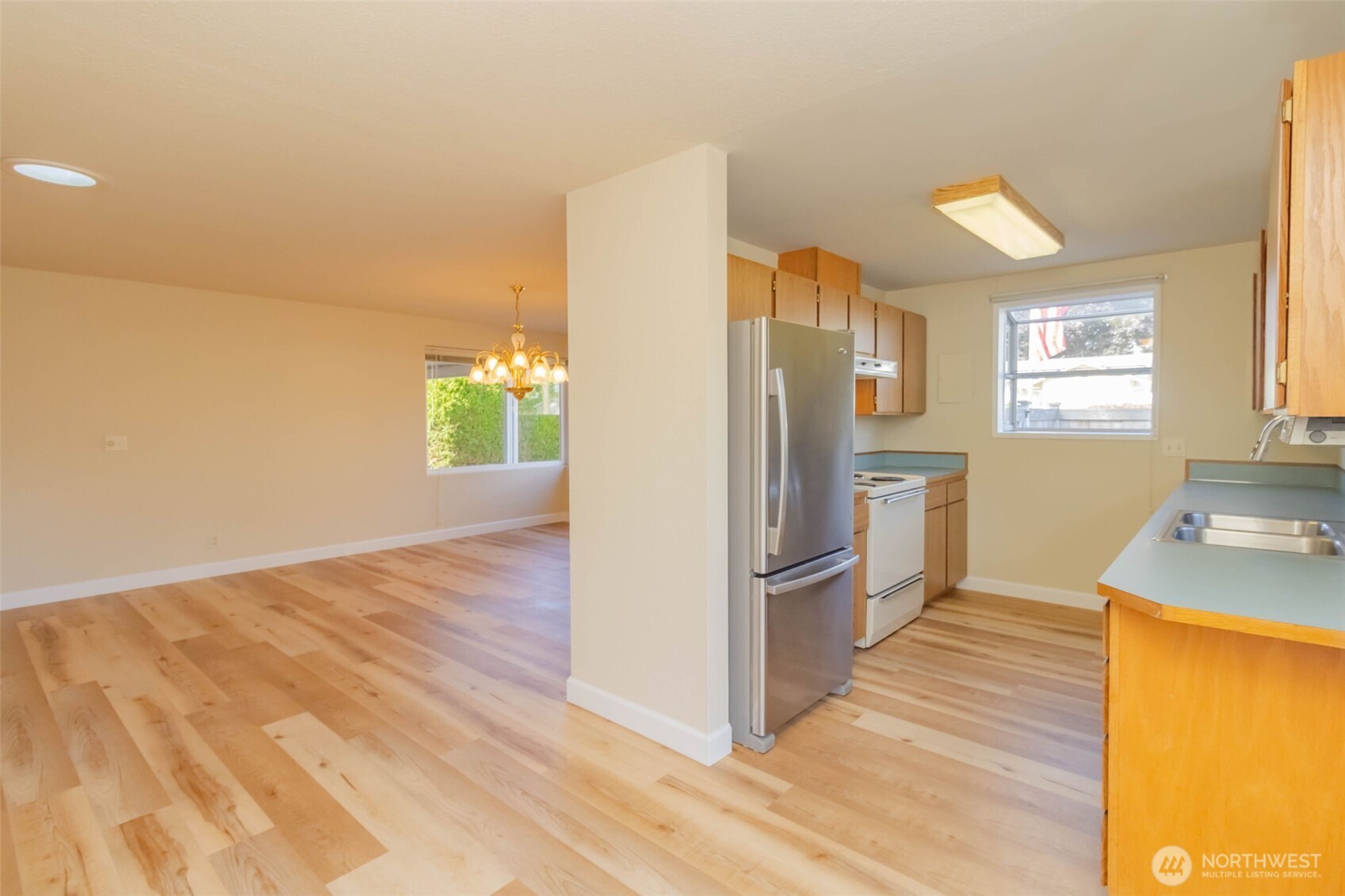 16958 121st Avenue Southeast Renton, WA 98058 - Photo 14 of 34 a kitchen with stainless steel appliances a refrigerator and a stove