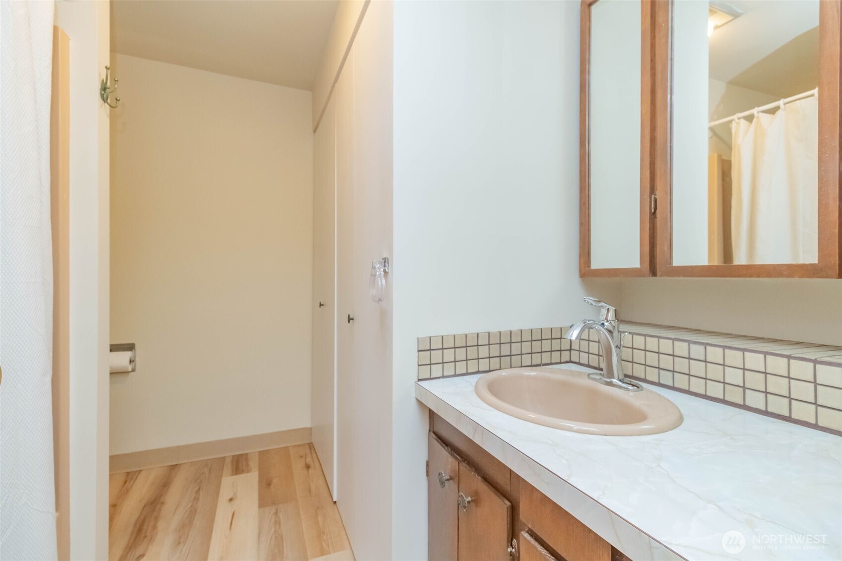 16958 121st Avenue Southeast Renton, WA 98058 - Photo 18 of 34 a bathroom with a sink and a mirror