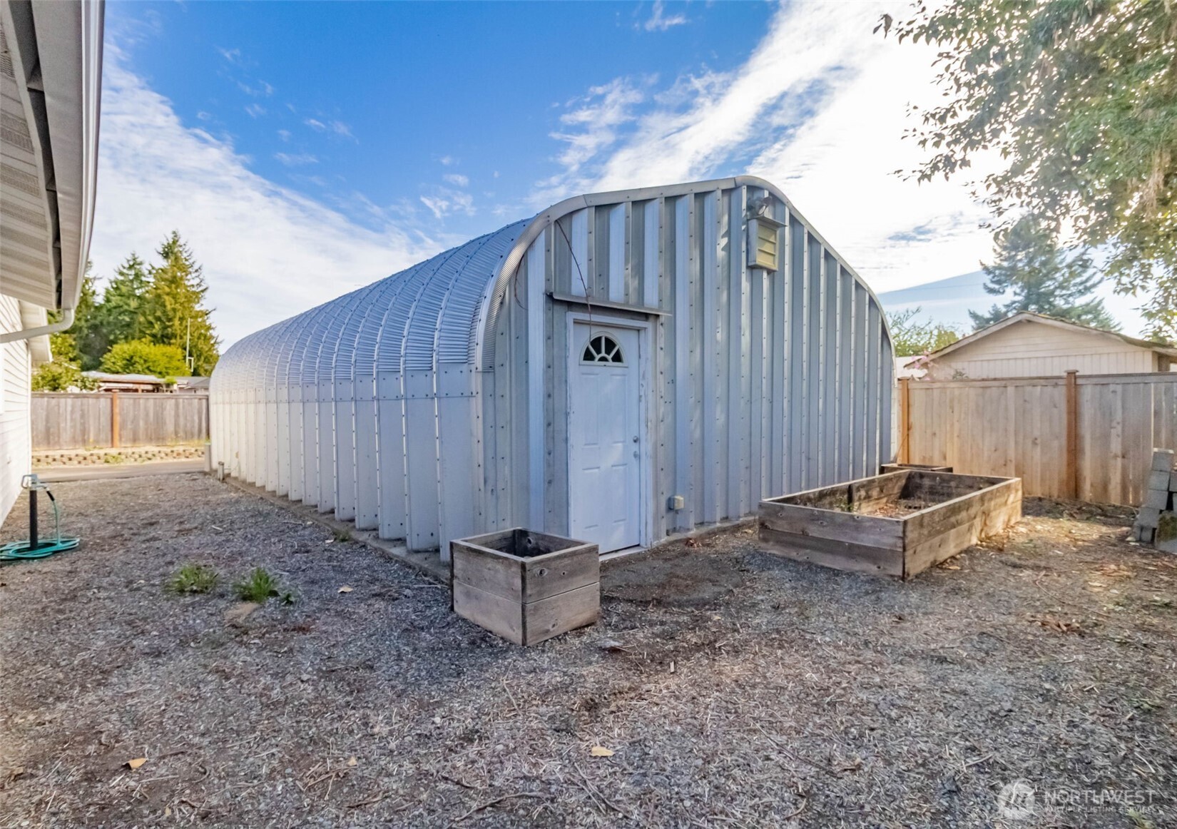 16958 121st Avenue Southeast Renton, WA 98058 - Photo 33 of 34 a backyard of a house with table and chairs