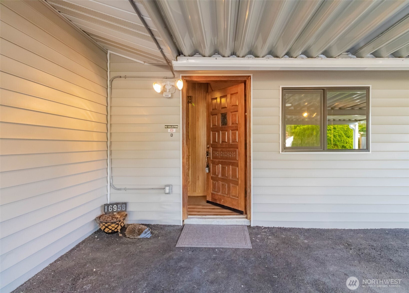 16958 121st Avenue Southeast Renton, WA 98058 - Photo 5 of 34 a view of a door and chair in front of house