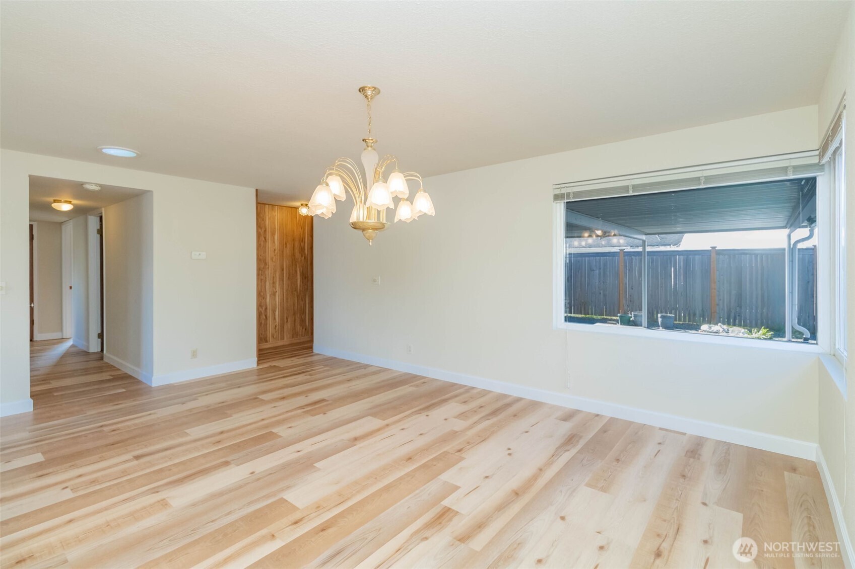 16958 121st Avenue Southeast Renton, WA 98058 - Photo 7 of 34 a view of a livingroom with a chandelier