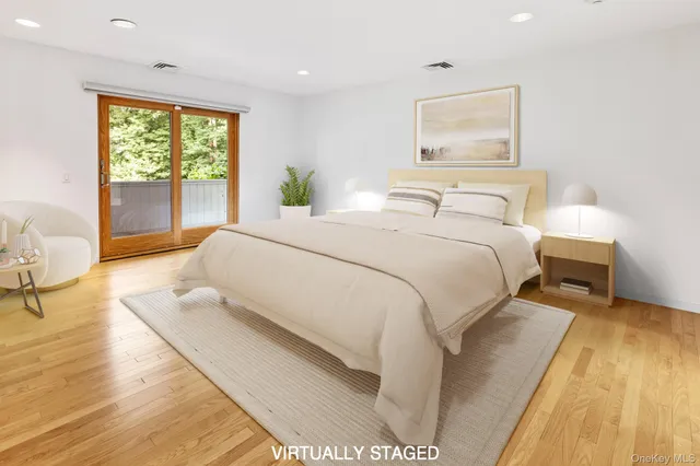 a house with green field in front of it