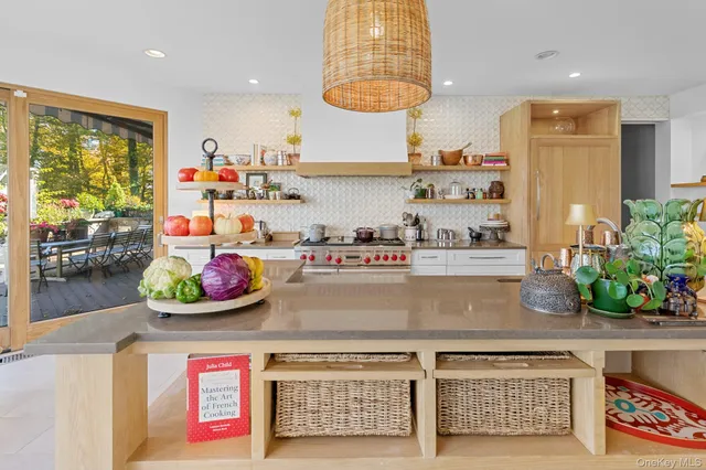 a view of a chairs and table in patio