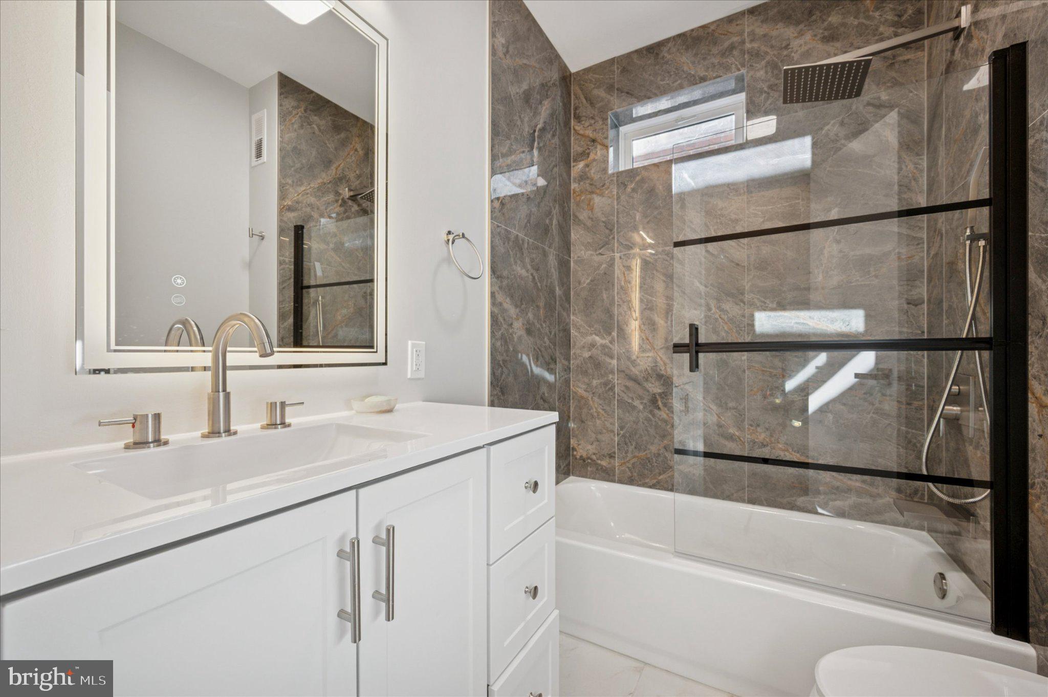 3026 Page Street Philadelphia, PA 19121 - Photo 15 of 24 a bathroom with a sink and a bathtub