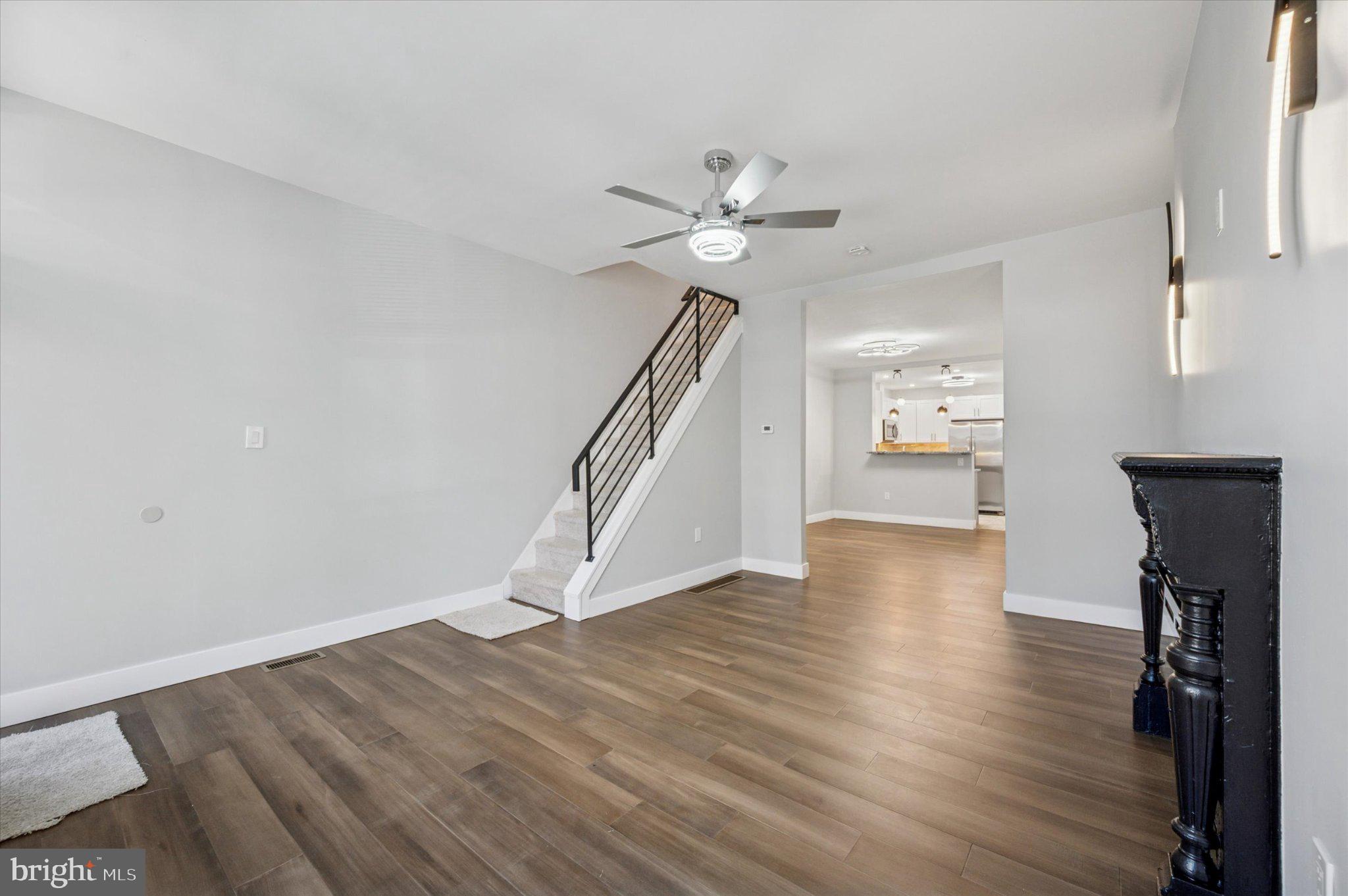 3026 Page Street Philadelphia, PA 19121 - Photo 2 of 24 a view of empty room with wooden floor and fan