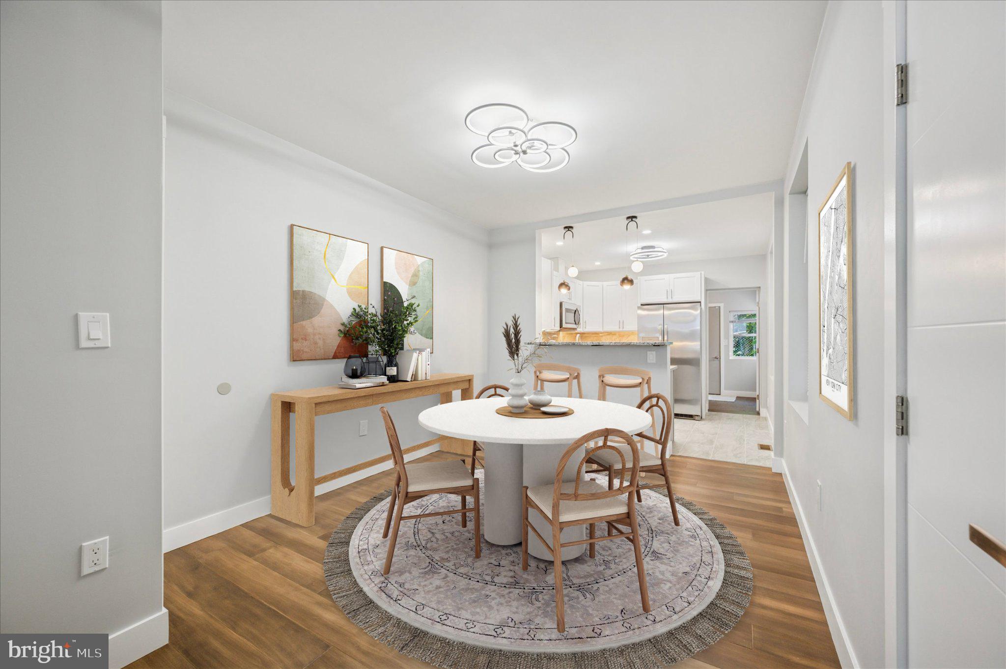 3026 Page Street Philadelphia, PA 19121 - Photo 21 of 24 a dining room with a table and chairs