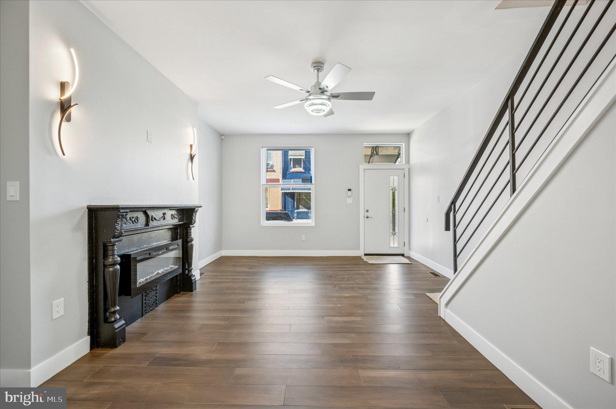 3026 Page Street Philadelphia, PA 19121 - Photo 4 of 24 wooden floor in an empty room with a window