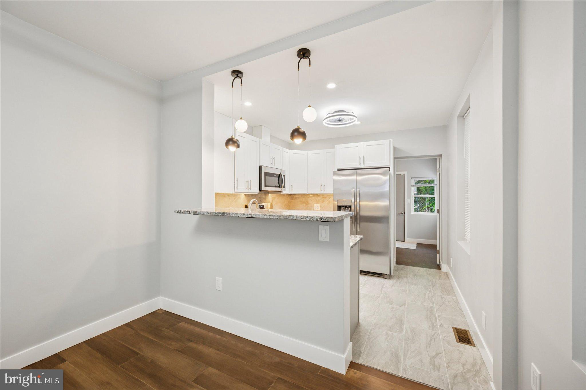 3026 Page Street Philadelphia, PA 19121 - Photo 6 of 24 a view of a kitchen with wooden floor