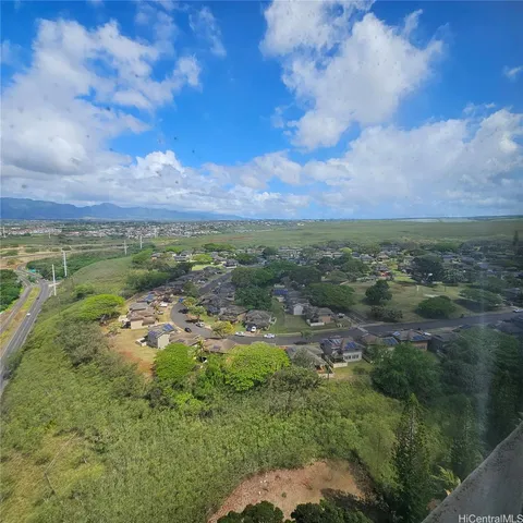 a view of a playground with basketball court