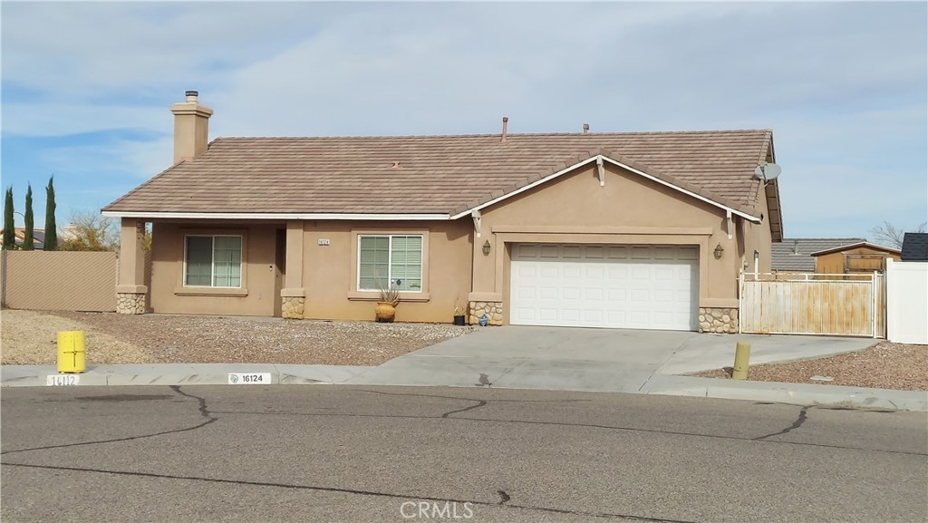 a view of a house with a outdoor space and garage