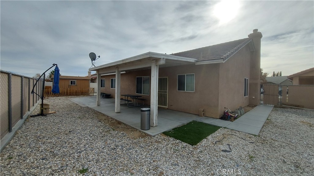 16124 Holly Ridge Court Victorville, CA 92395 - Photo 20 of 24 a view of a house with a yard