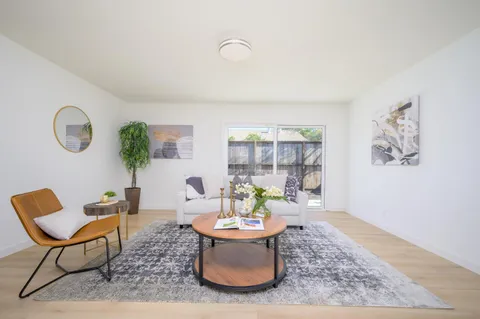 a bedroom with a bed and a potted plant