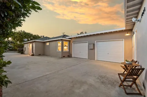 a kitchen with a sink a stove and cabinets