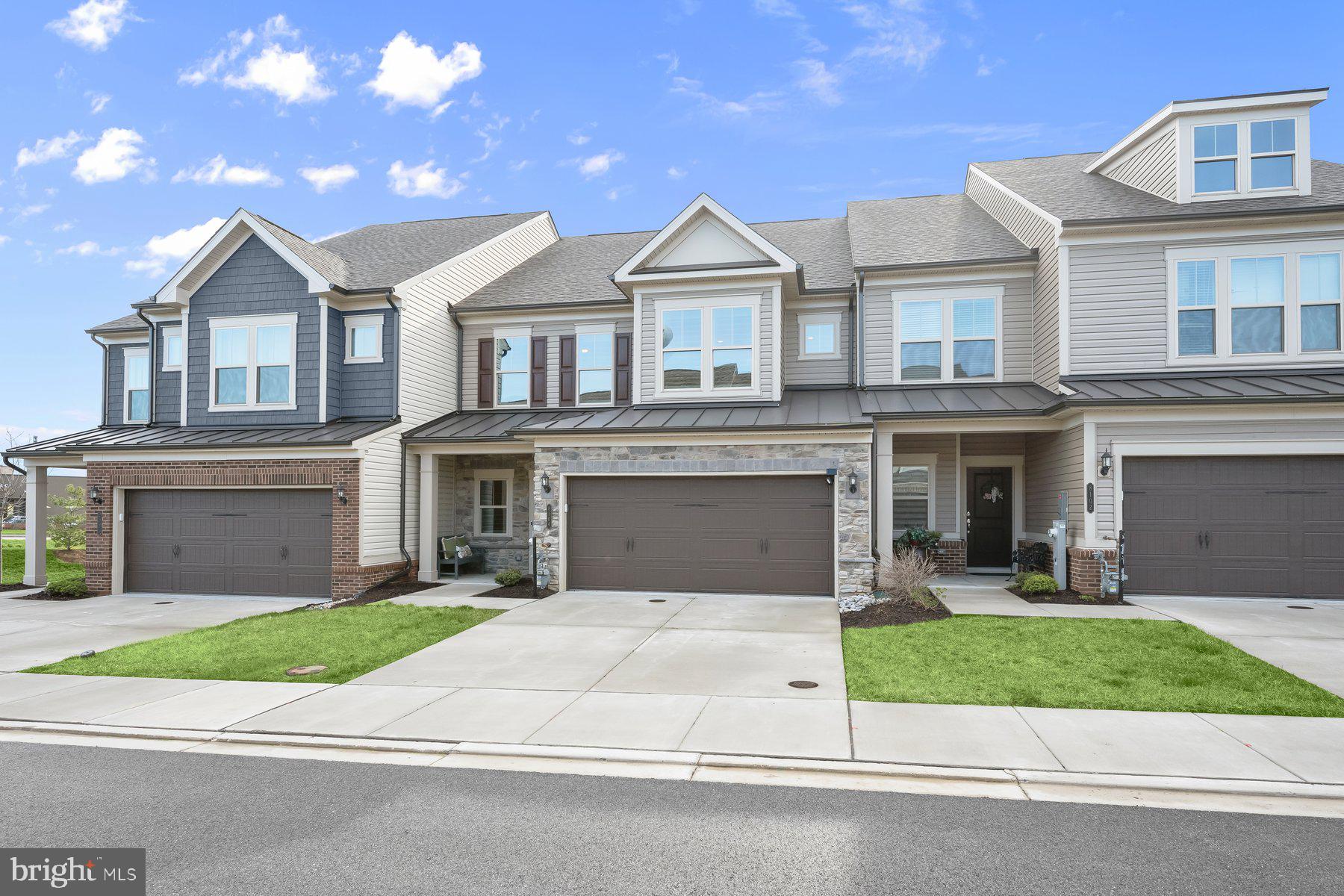 8104 Lisa Lane Fulton, MD 20759 - Photo 1 of 54 a front view of a house with a yard and garage