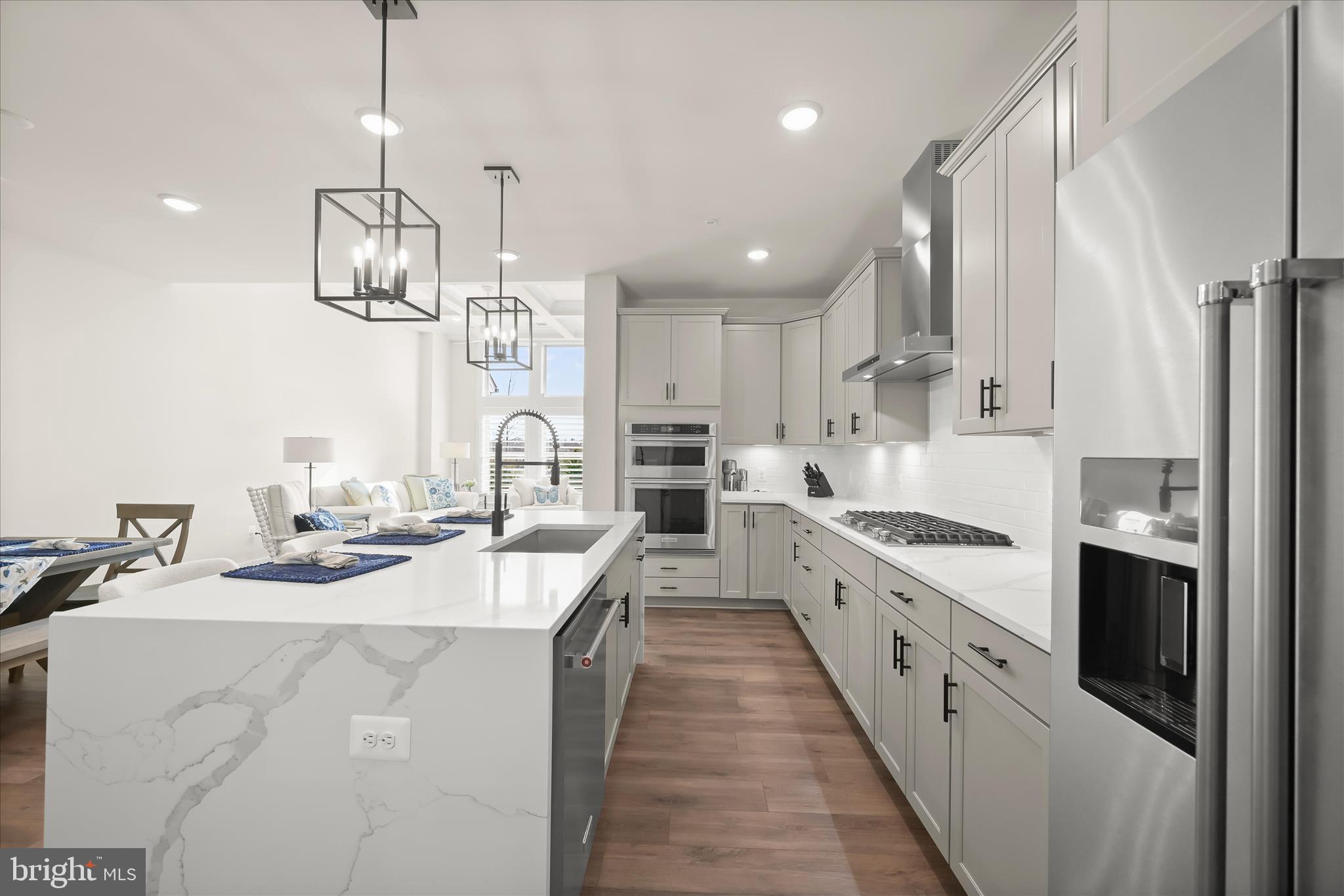 8104 Lisa Lane Fulton, MD 20759 - Photo 12 of 54 a kitchen with stainless steel appliances kitchen island granite countertop a sink and cabinets