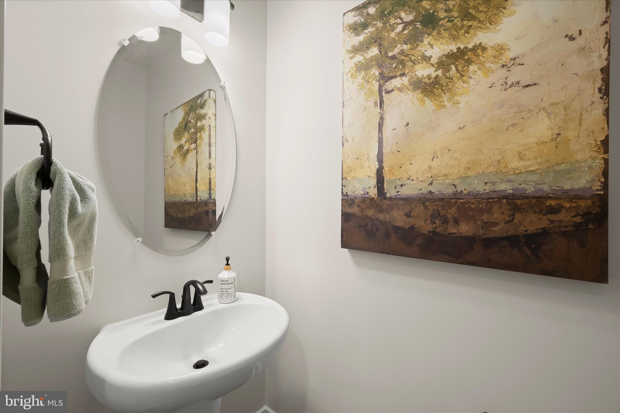 8104 Lisa Lane Fulton, MD 20759 - Photo 17 of 54 a bathroom with a sink and a mirror