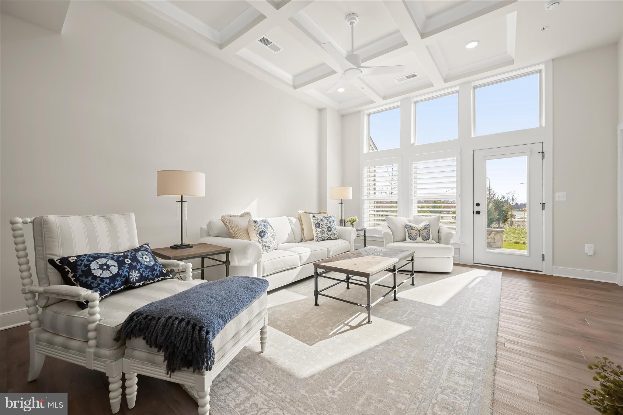 8104 Lisa Lane Fulton, MD 20759 - Photo 2 of 54 a spacious bedroom with a bed a large window with table and chairs