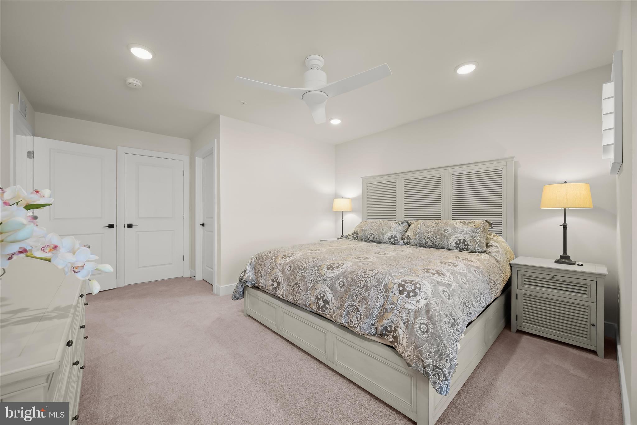 8104 Lisa Lane Fulton, MD 20759 - Photo 27 of 54 a bedroom with a bed and a night stand