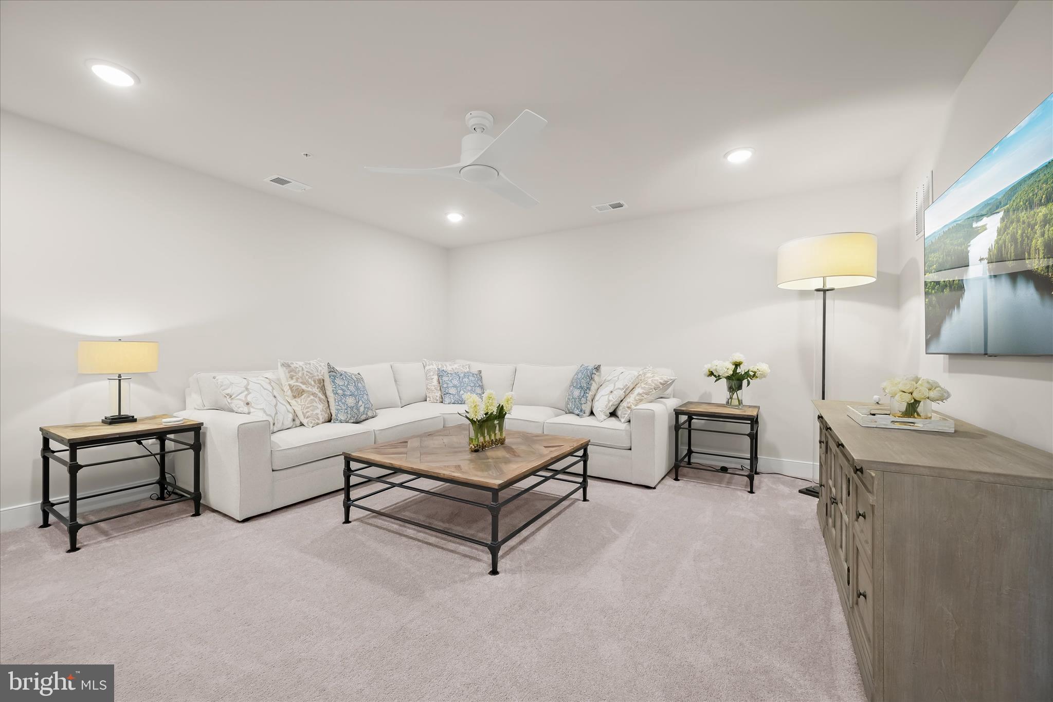 8104 Lisa Lane Fulton, MD 20759 - Photo 4 of 54 a living room with furniture and a lamp