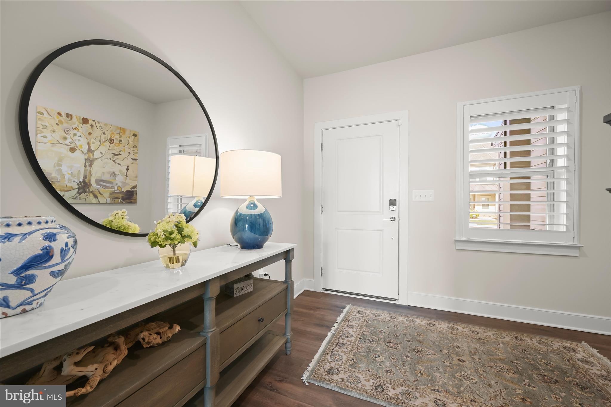 8104 Lisa Lane Fulton, MD 20759 - Photo 7 of 54 an entryway with wooden floor and mirror