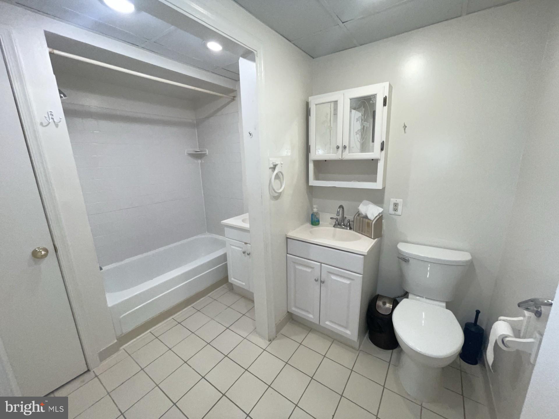 5904 L Bayshire Road, Unit L Springfield, VA 22152 - Photo 20 of 40 a bathroom with a toilet sink and mirror