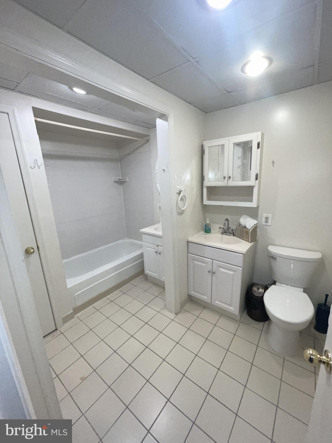 5904 L Bayshire Road, Unit L Springfield, VA 22152 - Photo 21 of 40 a bathroom with a sink toilet and a mirror