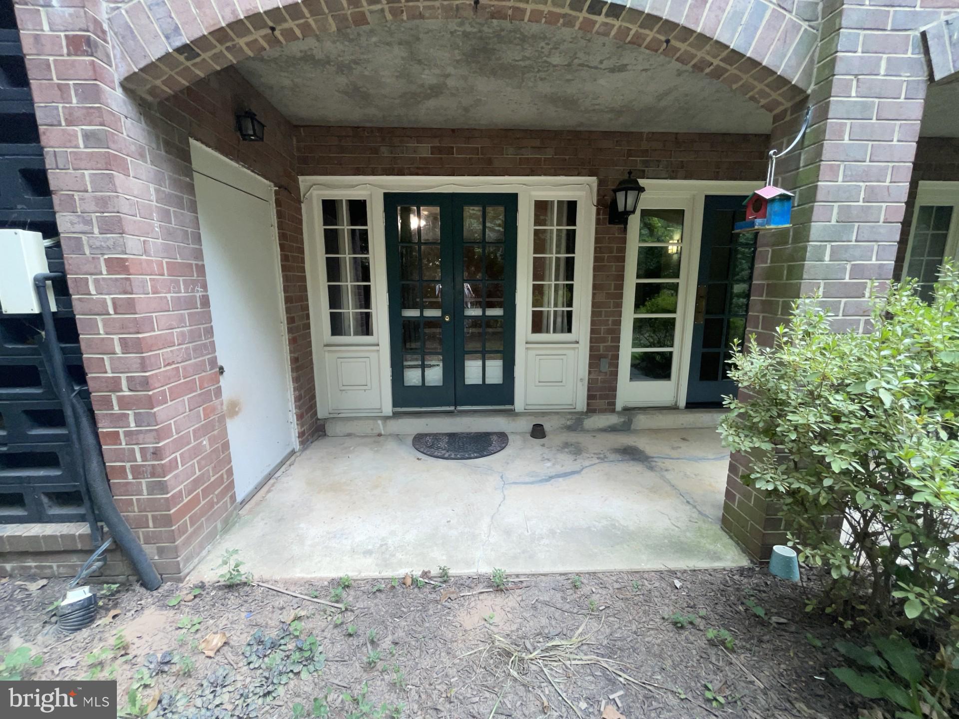 5904 L Bayshire Road, Unit L Springfield, VA 22152 - Photo 24 of 40 a view of a brick house with large windows