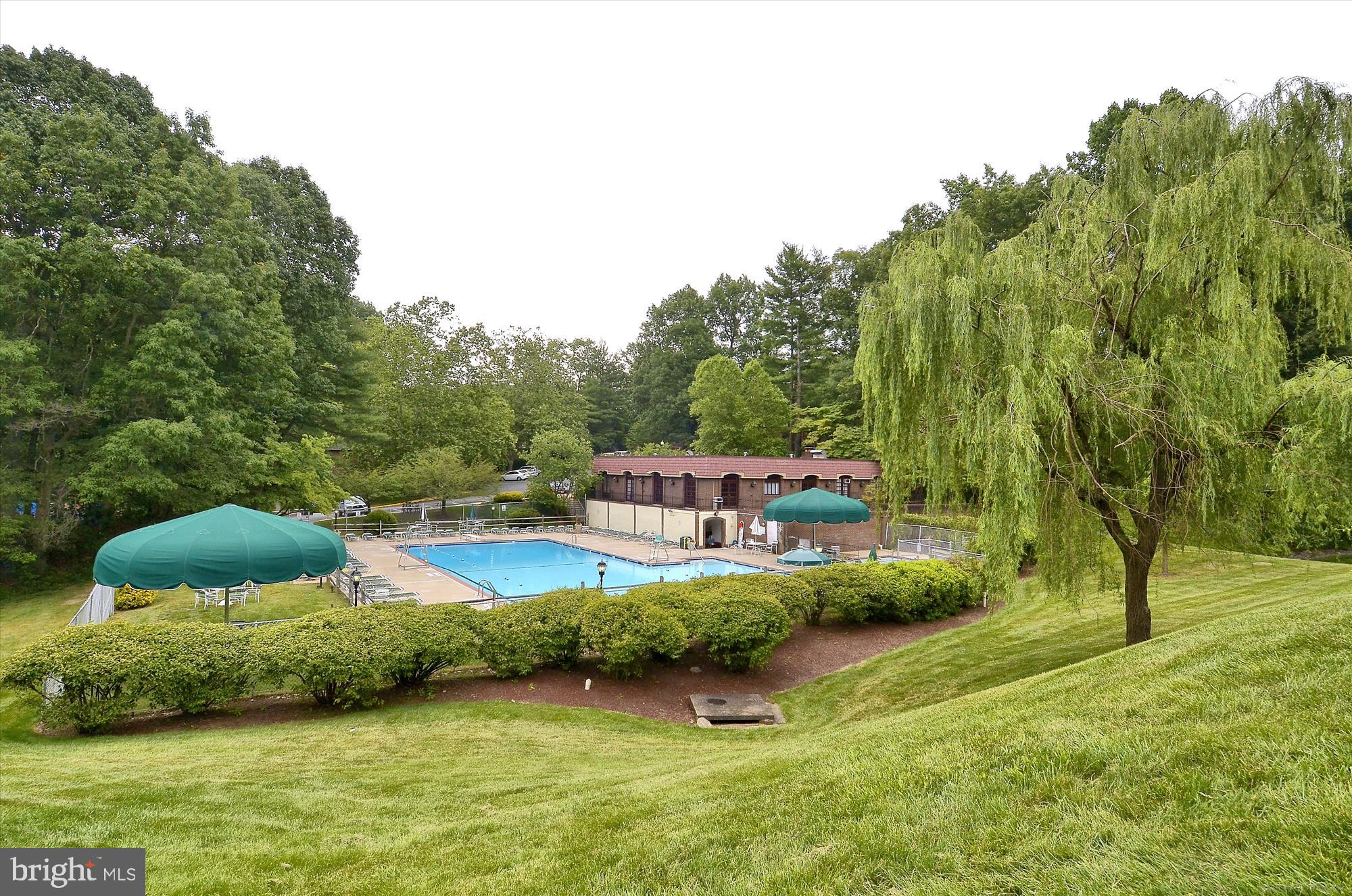 5904 L Bayshire Road, Unit L Springfield, VA 22152 - Photo 30 of 40 a view of a house with pool and a yard