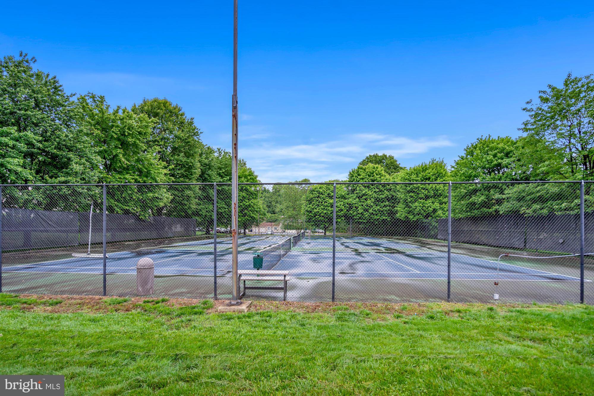 5904 L Bayshire Road, Unit L Springfield, VA 22152 - Photo 38 of 40 a garden with trees in front of it