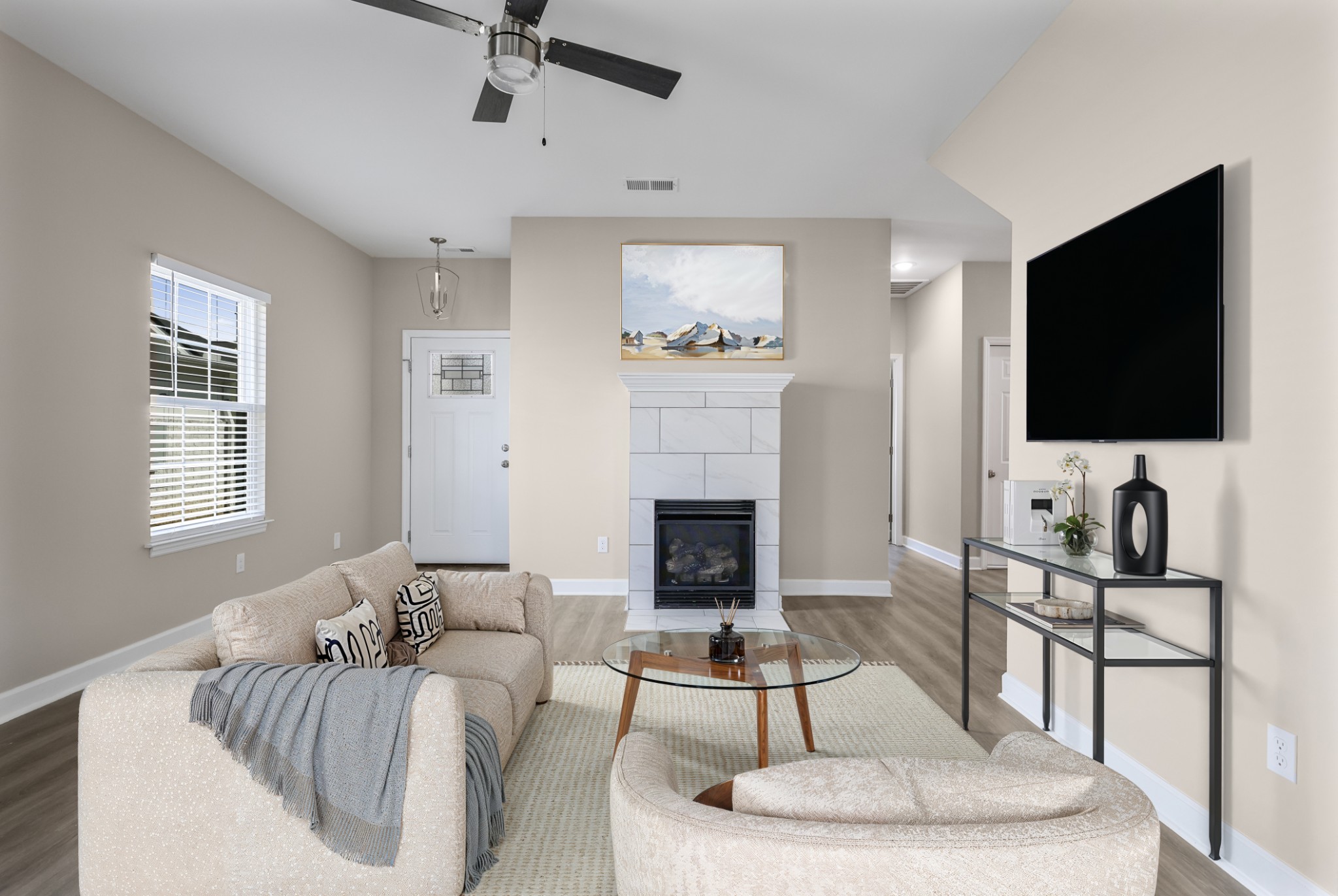 a living room with furniture and a flat screen tv